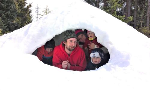 a group of people standing in a igloo in the snow at Apartmán Elenka in Zuberec