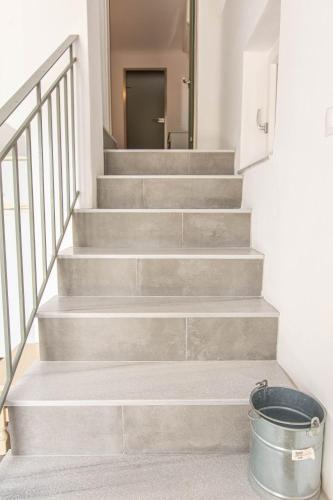 a set of stairs with a bucket in front of it at Peristeronas Village in Klouvas