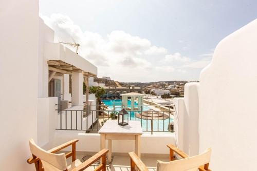 a view from the balcony of a house with a table and chairs at Peristeronas Village in Klouvas