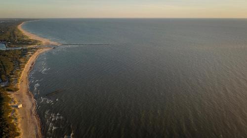 an aerial view of a beach and the ocean at 2NIGHT in Šventoji in Palanga
