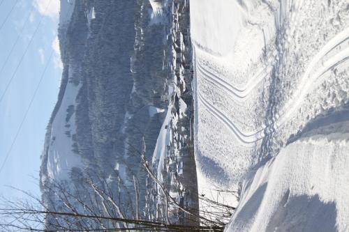 a view of a snow covered road with snow at otto steiner appartements pension ellmau & wilder kaiser in Ellmau