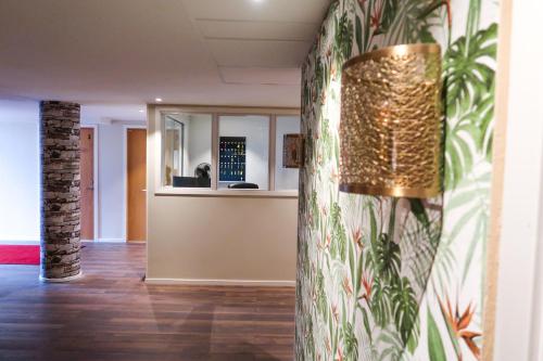 a hallway with a lobby with a reception desk at Hotel City Living in Stockholm