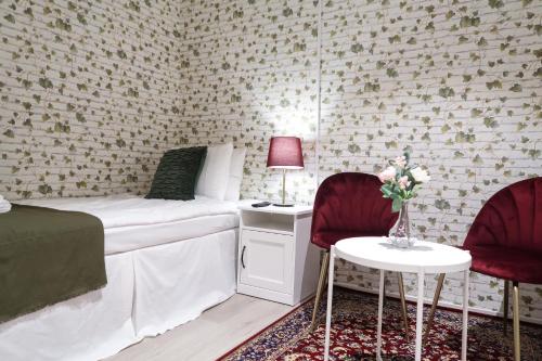 Un pat sau paturi într-o cameră la Hotel City Living