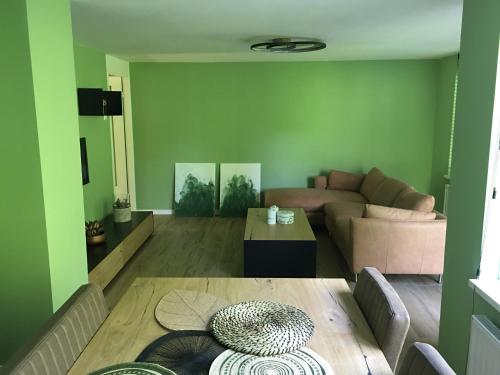 a living room with a couch and a table at Appartement Buiten de Veste 28 in Veere