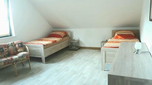 Voodi või voodid majutusasutuse Ferienwohnung Am Orlbach toas
