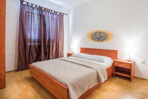 En eller flere senger på et rom på Apartments Krešo