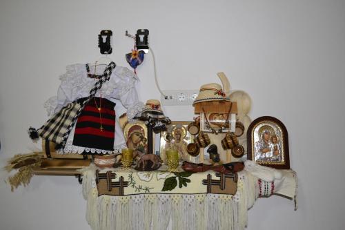 a table with various items on top of it at Pensiunea Malinul in Bîrsana