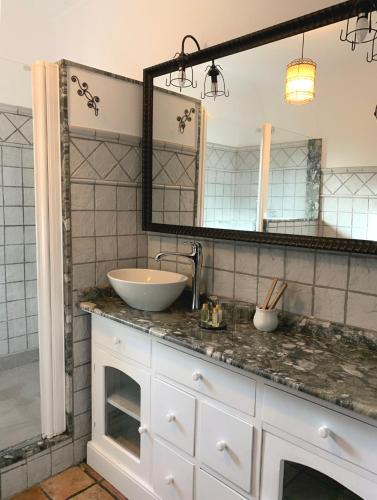 a bathroom with a sink and a mirror at Casa Bons Aires - adults only in Alcoy