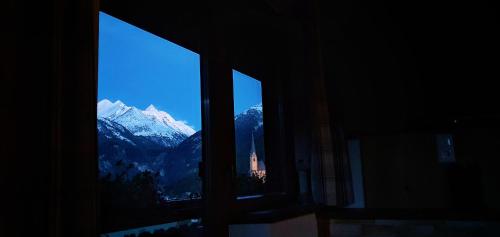a view from a window of a mountain view at HIESERHOF - Superior Alpine Apartments in Heiligenblut