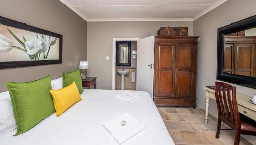 Ένα ή περισσότερα κρεβάτια σε δωμάτιο στο Excellent Guest House