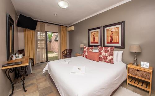 Tempat tidur dalam kamar di Excellent Guest House