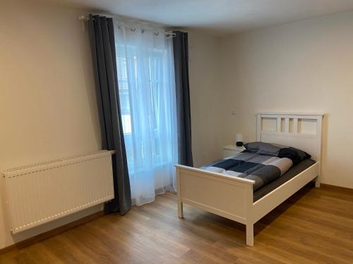 Postel nebo postele na pokoji v ubytování Appartments Siegenburg