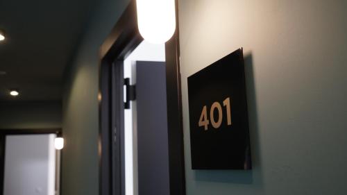 a sign on a wall with the number on it at MD Design Hotel - Portal del Real in Valencia