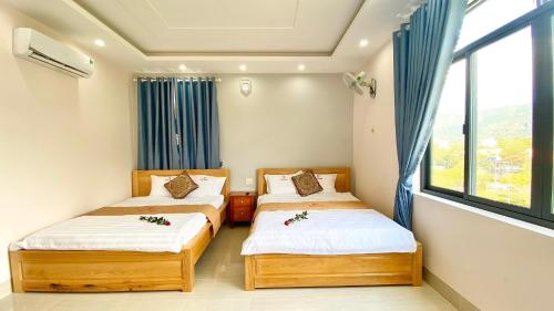 מיטה או מיטות בחדר ב-Gao Hotel