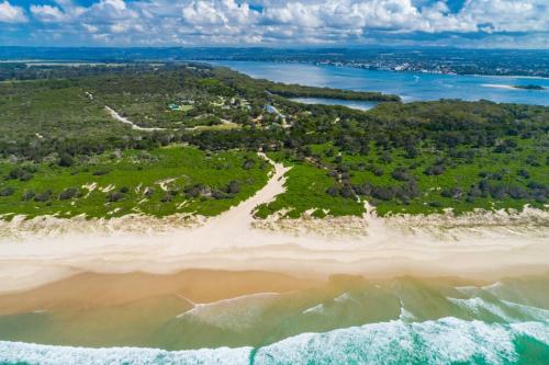 an aerial view of a beach and the ocean at Ballina Beach Nature Resort in Ballina