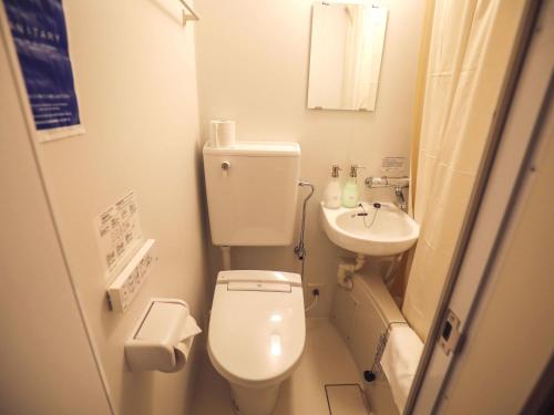 a small bathroom with a toilet and a sink at nirasakiyaSTAY in Nirasaki