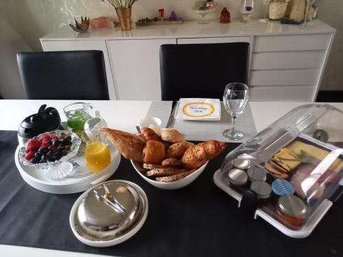 a table with a tray of breakfast food on it at CASA Victoria in Kuringen