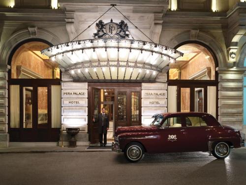 a car parked in front of a building at Pera Palace Hotel in Istanbul