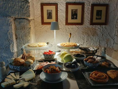 a table topped with lots of different types of food at Antica Corte Panego in Negrar