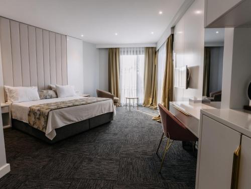 Postel nebo postele na pokoji v ubytování Özkum Park Otel