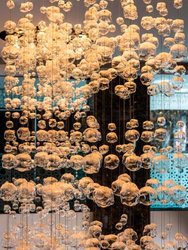 a display of chandeliers in a store window at Royal Tulip Muscat in Muscat