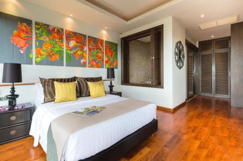 Säng eller sängar i ett rum på Baan View Talay