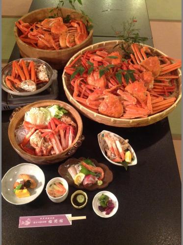 a table with three bowls of different types of food at Fukumakan in Matsue