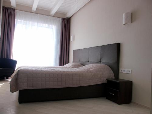 Кровать или кровати в номере Hotel Nika 2