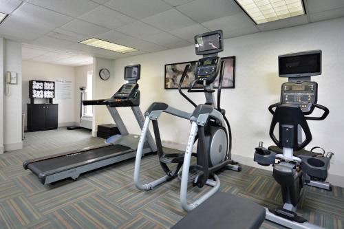 a gym with two exercise bikes and a treadmill at Holiday Inn Express Lynchburg by IHG in Lynchburg