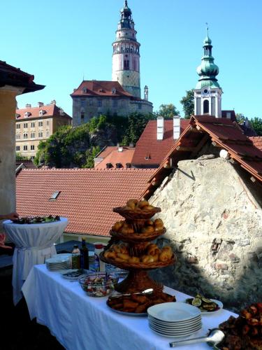 a table with a bunch of food on it at Hotel Peregrin in Český Krumlov