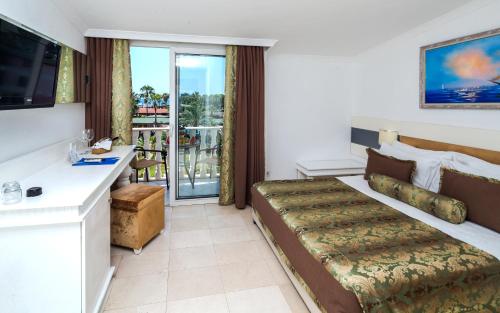 Postel nebo postele na pokoji v ubytování Onkel Resort Hotel