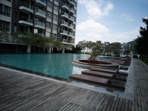 a swimming pool in the middle of a building at Urban 360 Studio Love Rara Suite Homestay in Batu Caves