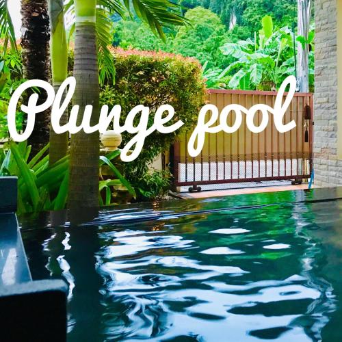 a swimming pool with the text summer pool at Tiger Cave Home in Krabi