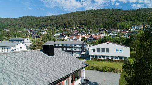 an aerial view of a town with a mountain at Molde Vandrerhjem Hostel in Molde
