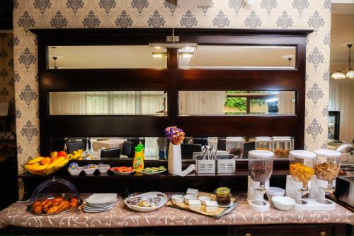 a buffet of food on a table in a restaurant at Curtea Bizantina in Suceava