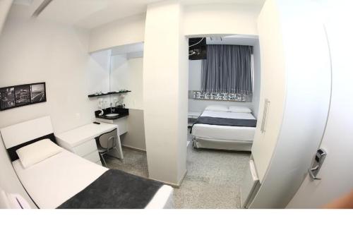 En eller flere senge i et værelse på Compacto Hotel Alphaville Campinas