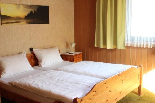 Säng eller sängar i ett rum på Landgasthof Wiesenmühle