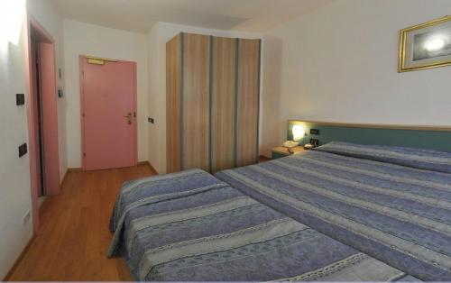 Postel nebo postele na pokoji v ubytování Hotel Vela
