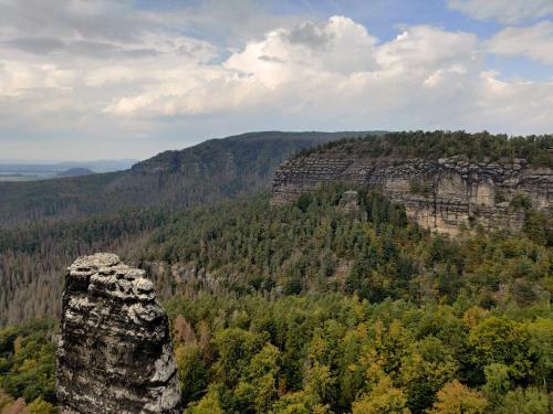 a view of a mountain with trees and rocks at Mezná 85 in Hřensko