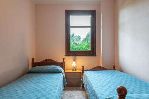 Katil atau katil-katil dalam bilik di Appartamento Chia C