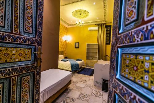 מיטה או מיטות בחדר ב-Palais Shazam & SPA