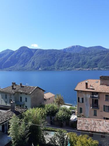 a view of a large body of water with mountains at B&B-FORESTERIA Casa Della Musica Lake Como in Mandello del Lario