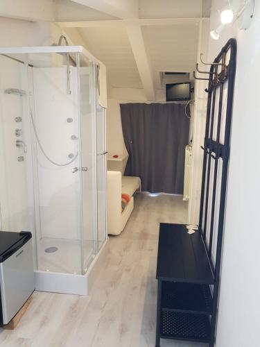 a bathroom with a shower and a glass door at Dormi da me sul mare in Civitanova Marche