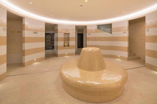 a large straw hat sitting on the floor of a room at Hotel Kultúra in Ružomberok