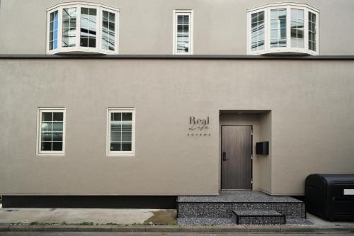 a building with a door with the word heal written on it at Real Life AOYAMA in Tokyo