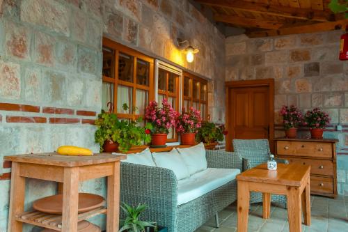 a living room with a couch and a table at Seosko turisticko domacinstvo Radivojevic in Čačak