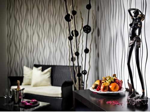 a room with a table with a plate of food at Hotel Residenz Bad Frankenhausen in Bad Frankenhausen
