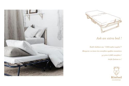 a bedroom with a bed and a chair with a book at Kinfeels' downtown apartment B1 in Larisa