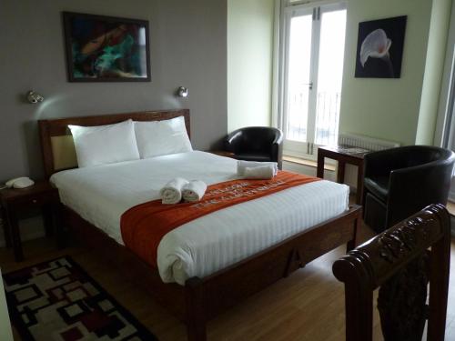 Amsterdam Hotel Brighton Seafrontにあるベッド
