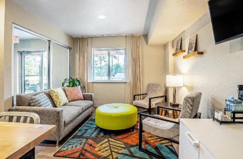 a living room with a couch and a table at WoodSpring Suites Allentown in Allentown